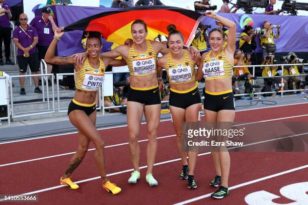 Bronze medalists Tatjana Pinto, Alexandra Burghardt, Gina Luckenkemper, and Rebekka Haase of Team Germany pose after competing in the Women's 4x100m...