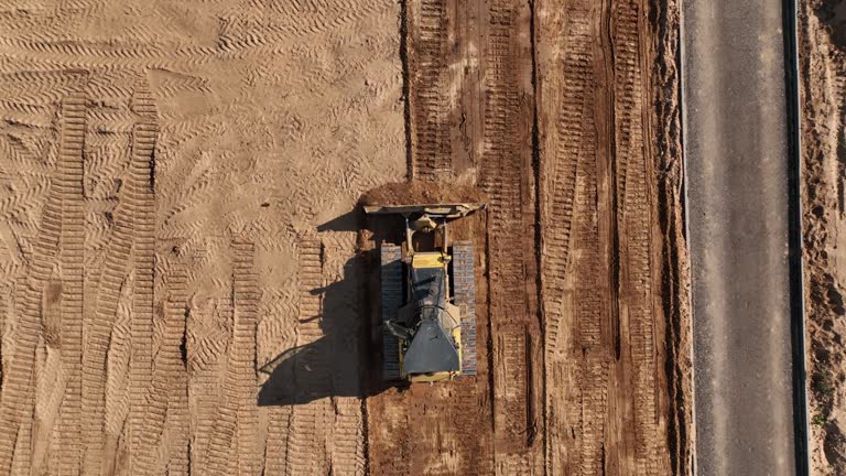 https://media.gettyimages.com/id/1410555257/video/dozer-levelling-the-ground-during-road-construction-aerial-view.jpg?b=1&s=640x640&k=20&c=oI3t8TLMKJ32M_x8OBw3IQzIZ6b__WbT39FPjSCT_uw=