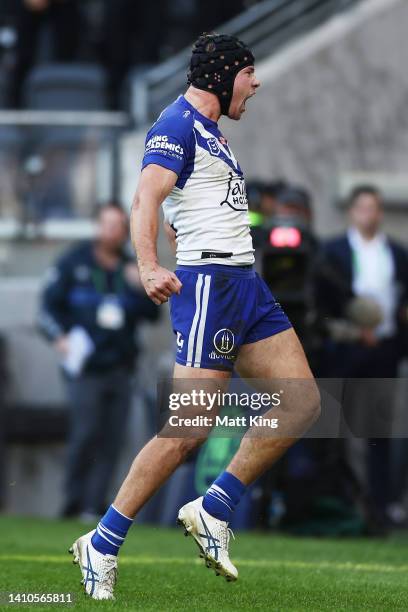 Matt Burton of the Bulldogs celebrates scoring a try during the round 19 NRL match between the Canterbury Bulldogs and the Gold Coast Titans at...