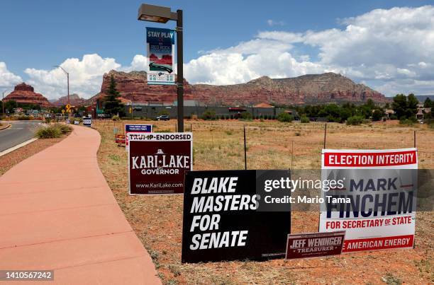 Campaign posters are displayed ahead of Arizona’s primary election on July 23, 2022 in Sedona, Arizona. Former President Donald Trump and former Vice...