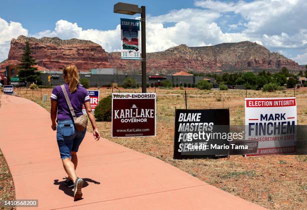 Campaign posters are displayed ahead of Arizona’s primary election on July 23, 2022 in Sedona, Arizona. Former President Donald Trump and former Vice...