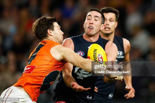 Jacob Weitering of the Blues and Toby Greene of the Giants contest the ball during the round 19 AFL match between the Carlton Blues and the Greater...