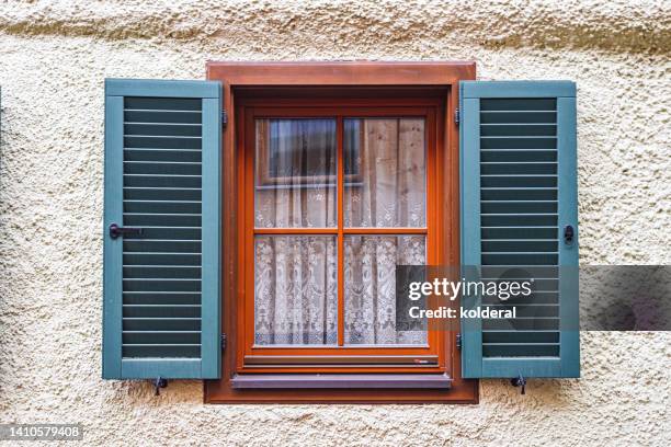 wooden window with blue shutters and brown frame - shutter stock pictures, royalty-free photos & images