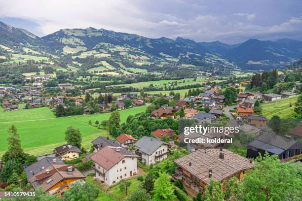 aerial view of kitzbuhel valley and chalet style residential buildings - kitzbuhel stock pictures, royalty-free photos & images