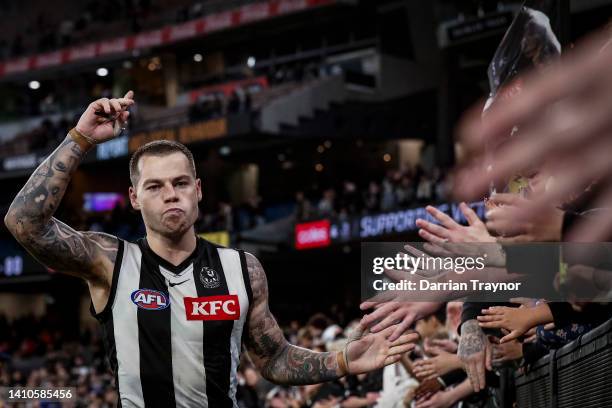 Jamie Elliott of the Magpies acknowledges the fans after the round 19 AFL match between the Collingwood Magpies and the Essendon Bombers at Melbourne...