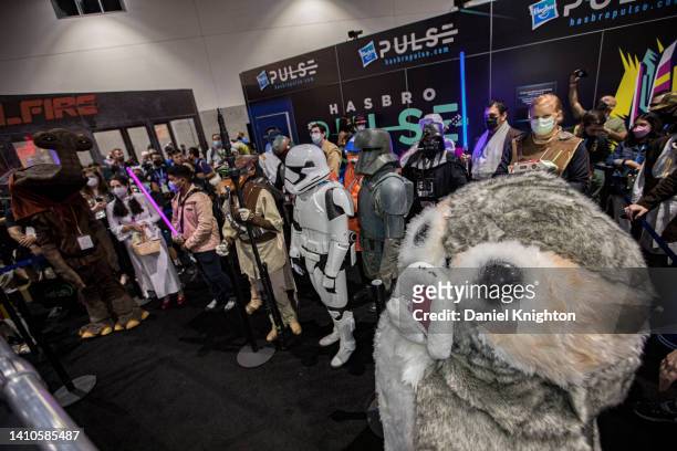 Star Wars cosplayers compete in a costume contest at the Pulse Hasbro booth at 2022 Comic-Con International Day 3 at San Diego Convention Center on...
