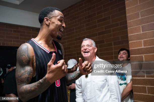 John Collins and Atlanta Hawks owner Antony Ressler talk after the game during the Drew League Pro-Am at King Drew Magnet High School on July 23,...