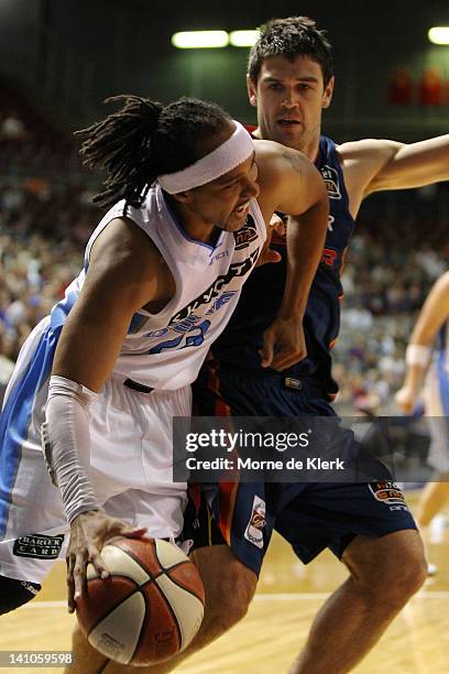 Bruton of the Breakers surges past Nathan Herbert of the 36ers during the round 23 NBL match between the Adelaide 36ers and the New Zealand Breakers...