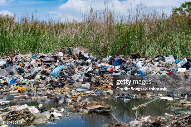 pollution, global warming, garbage - river pollution stock pictures, royalty-free photos & images