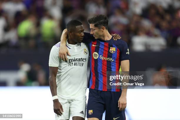 David Alaba of Real Madrid and Robert Lewandowski of Barcelona talk during the preseason friendly match between Real Madrid and Barcelona at...