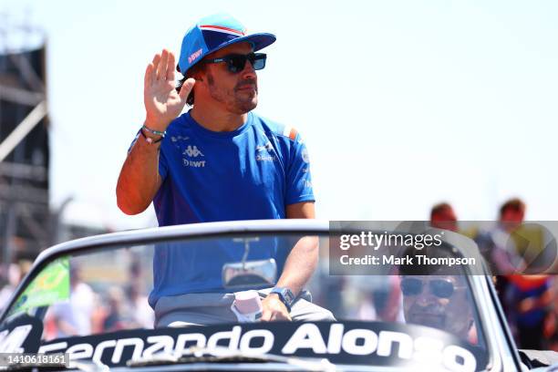 Fernando Alonso of Spain and Alpine F1 waves to the crowd on the drivers parade ahead of the F1 Grand Prix of France at Circuit Paul Ricard on July...