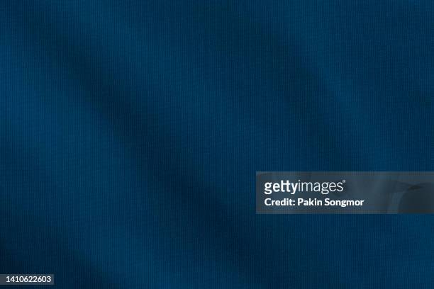 dark blue color sports clothing fabric football shirt jersey texture and textile background. - football background foto e immagini stock