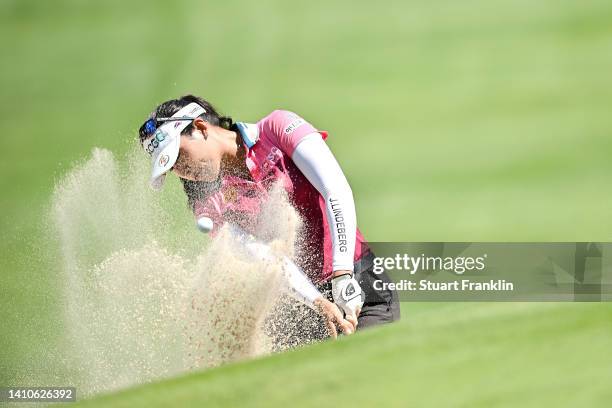 Atthaya Thitikul of Thailand plays her second shot form the bunker on the ninth hole during day four of The Amundi Evian Championship at Evian Resort...