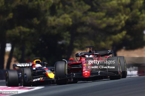 Charles Leclerc of Monaco driving the Ferrari F1-75 leads Max Verstappen of the Netherlands driving the Oracle Red Bull Racing RB18 during the F1...