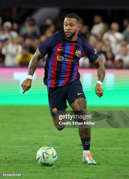 Memphis Depay of Barcelona dribbles the ball up the pitch against Real Madrid during their preseason friendly match at Allegiant Stadium on July 23,...