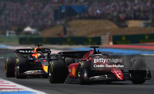 Charles Leclerc of Monaco driving the Ferrari F1-75 leads Max Verstappen of the Netherlands driving the Oracle Red Bull Racing RB18 during the F1...