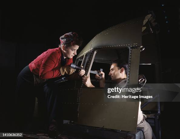 Riveting Team Working On The Cockpit Shell Of A...Douglas Aircraft Co