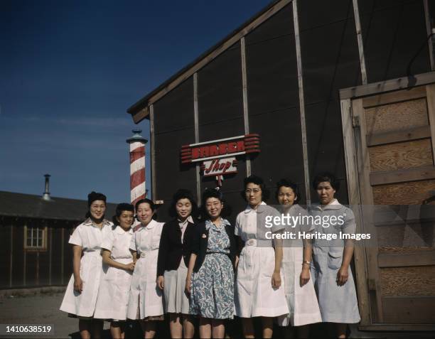 Japanese-American camp, war emergency evacuation,[Tule Lake Relocation Center, Newell, Calif. Photo shows eight women standing in front of a camp...