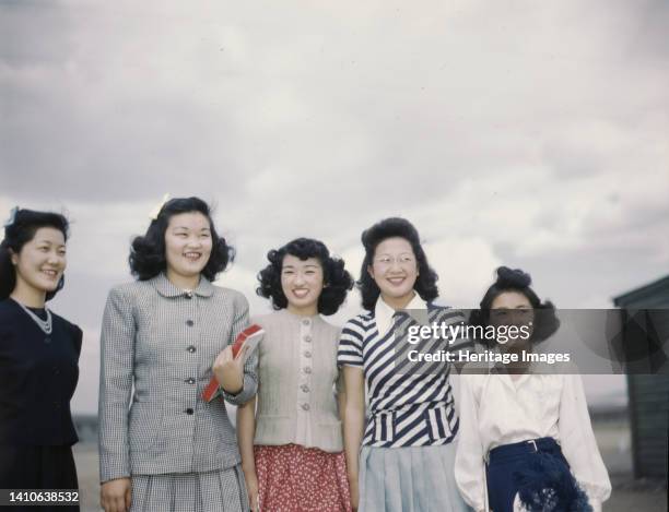 Japanese-American camp, war emergency evacuation, [Tule Lake Relocation Center, Newell, Calif. Photo shows five smiling women. Artist Unknown.