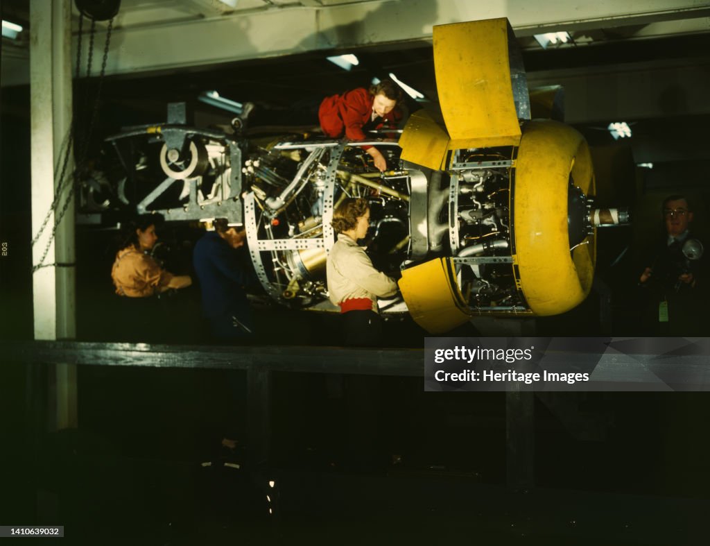 Installing One Of The 4 Motors On The Transport Plane At Willow Run