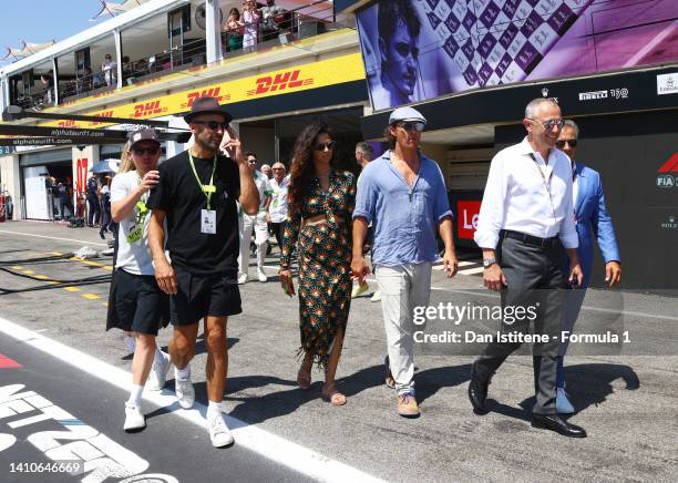 Stefano Domenicali, CEO of the Formula One Group, talks with Jean Alesi, Matthew McConaughey, Camilla Alves McConaughey and JR during the F1 Grand...
