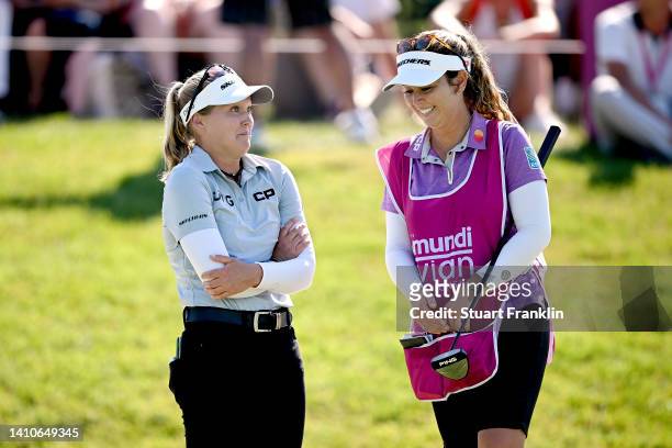 Brooke M. Henderson of Canada reacts with her caddie at the eighteenth hole during day four of The Amundi Evian Championship at Evian Resort Golf...