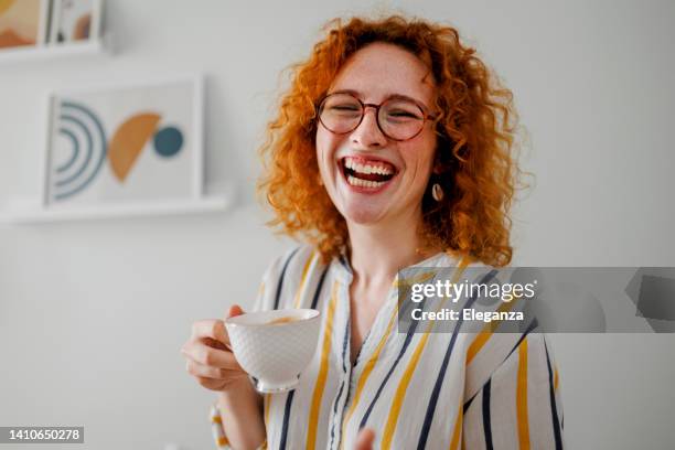 young ginger woman drinking coffee - breakfast work stock pictures, royalty-free photos & images