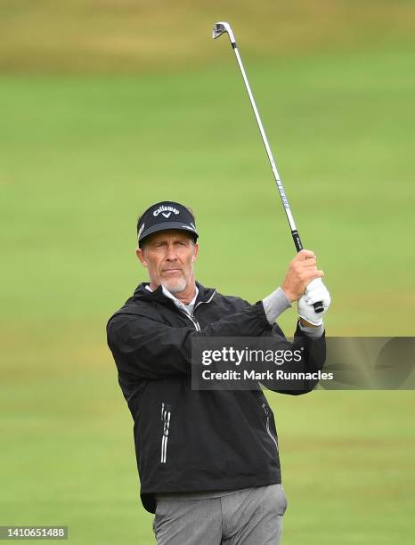 Stuart Appleby of Australia plays his second shot to the 1st hole during Day Four of The Senior Open Presented by Rolex at The King's Course at...