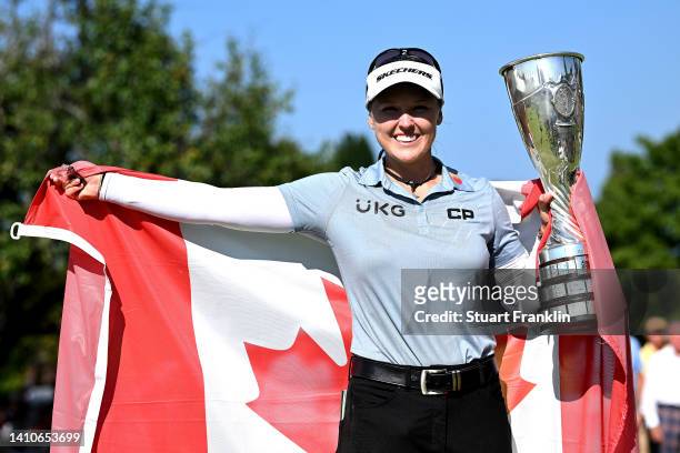 Brooke M. Henderson of Canada lift the trophy after winning the The Amundi Evian Championship during day four of The Amundi Evian Championship at...
