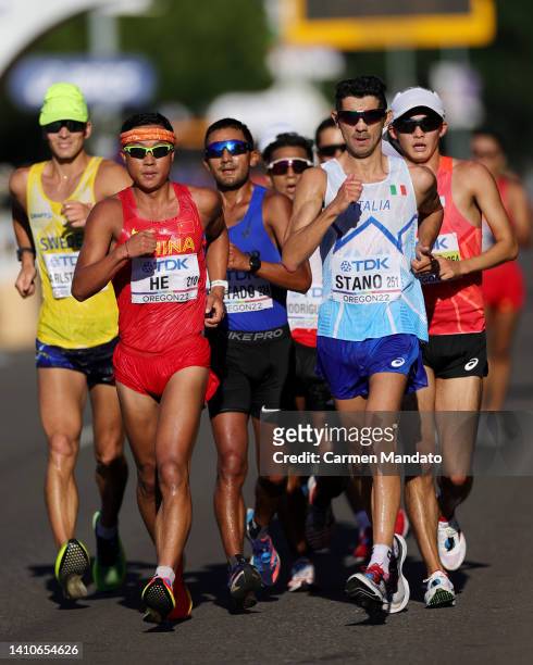 Xianghong He of Team China and Massimo Stano of Team Italy compete in the Men's 35km Race Walk Final on day ten of the World Athletics Championships...