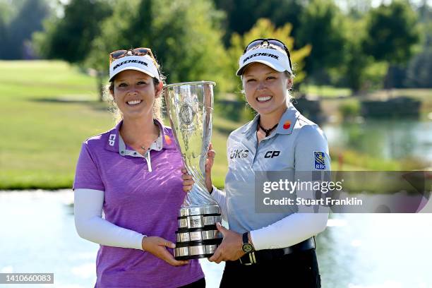 Brooke M. Henderson of Canada lift the trophy after winning the The Amundi Evian Championship with her caddie during day four of The Amundi Evian...