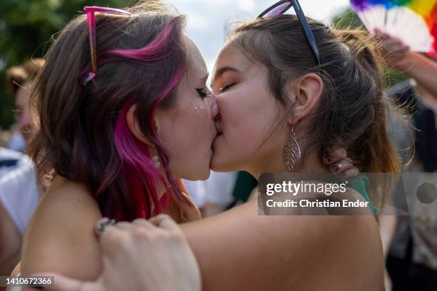 Two women, who said they did not mind being photographed, kiss each other and participate in the annual Christopher Street Day parade and dance in a...