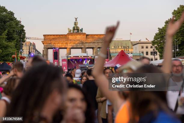 People participate in the annual Christopher Street Day parade and dance in the evening after a procession through the city between Brandenburg Gate...