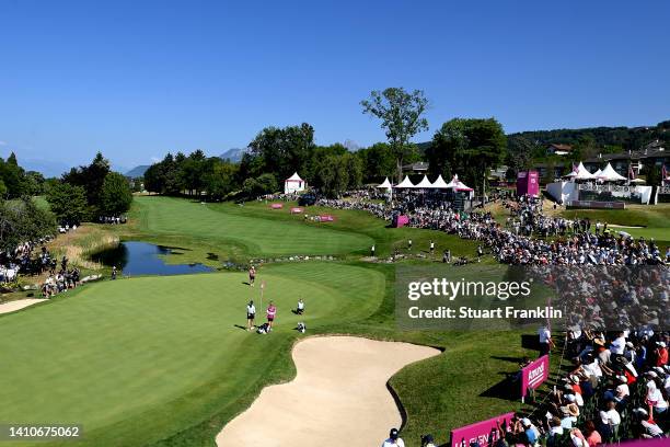 Brooke M. Henderson of Canada makes her final putt at the eighteenth hole during day four of The Amundi Evian Championship at Evian Resort Golf Club...