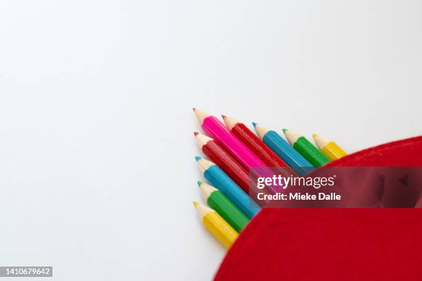 pencil case with colored pencils - colored pencil arrow stock pictures, royalty-free photos & images