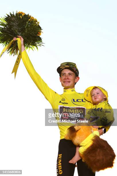 Jonas Vingegaard Rasmussen of Denmark and Team Jumbo - Visma celebrates with his daughter Frida the Yellow Leader Jersey on the podium ceremony after...