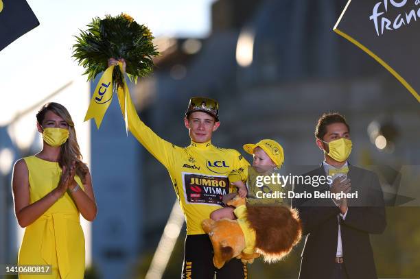 Jonas Vingegaard Rasmussen of Denmark and Team Jumbo - Visma celebrates with his daughter Frida the Yellow Leader Jersey on the podium ceremony after...