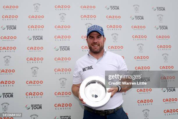 Richie Ramsay of Scotland poses with the trophy during Day Four of the Cazoo Classic at Hillside Golf Club on July 24, 2022 in Southport, England.