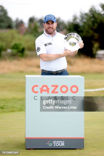 Richie Ramsay of Scotland poses with the trophy after wiining the Day Four of the Cazoo Classic at Hillside Golf Club on July 24, 2022 in Southport,...