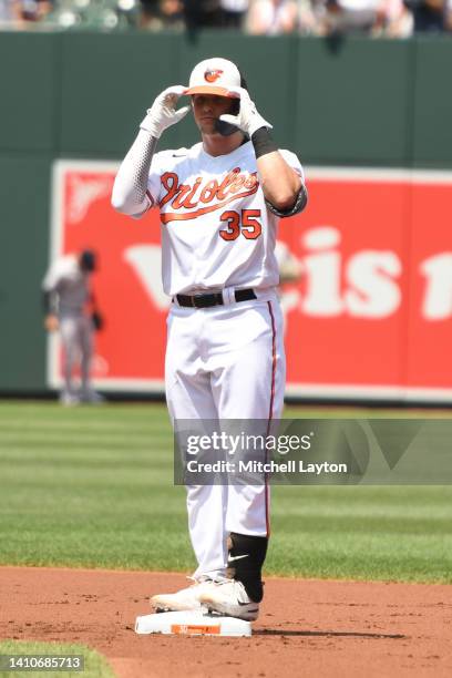 Adley Rutschman of the Baltimore Orioles celebrates a double in the second inning during a baseball game against the New York Yankees at Oriole Park...