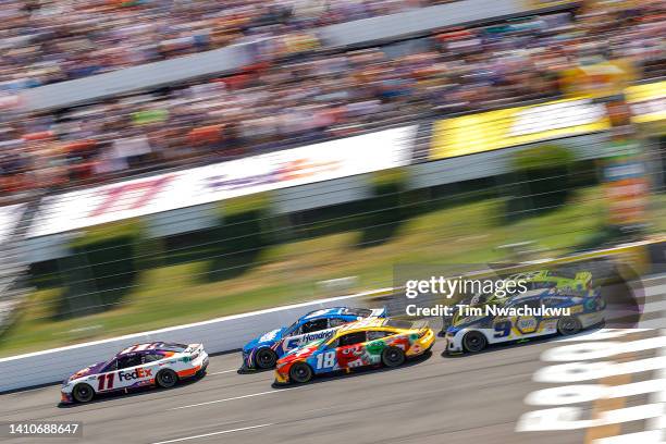 Denny Hamlin, driver of the FedEx Office Toyota, Kyle Busch, driver of the M&Ms Toyota, Kyle Larson, driver of the HendrickCars.com Chevrolet, Chase...