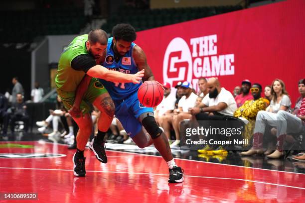 Glen Rice Jr. #41 of the Power drives against Dusan Bulut of the Aliens during BIG3 Week Six at Comerica Center on July 24, 2022 in Frisco, Texas.