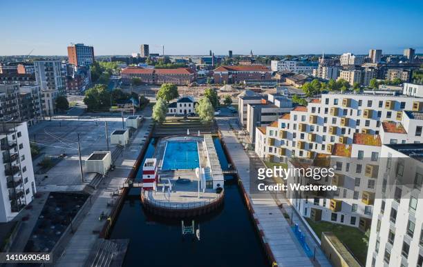 odense harbor with harbor bath - odense denmark stock pictures, royalty-free photos & images