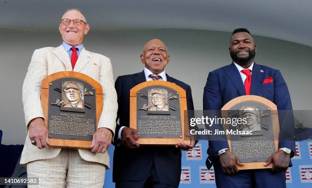 Jim Kaat, Tony Oliva and David Ortiz pose for a photograph with their plaques after the Baseball Hall of Fame induction ceremony at Clark Sports...