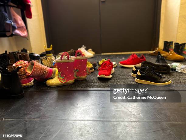 shoes left at classroom door - school rules stockfoto's en -beelden