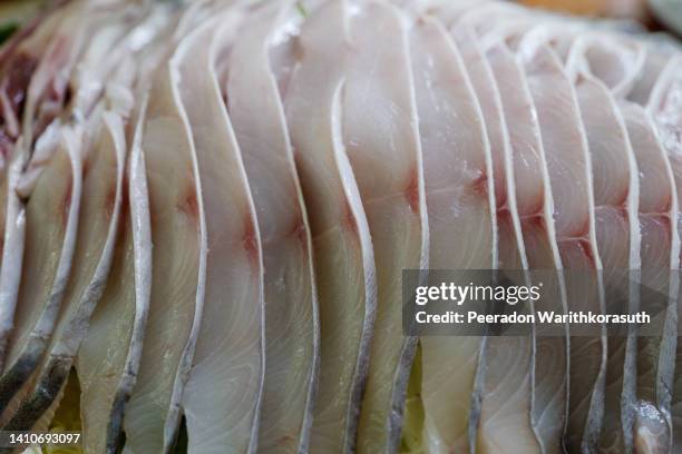 sliced of raw stingray fish meat. - mosca de la carne fotografías e imágenes de stock