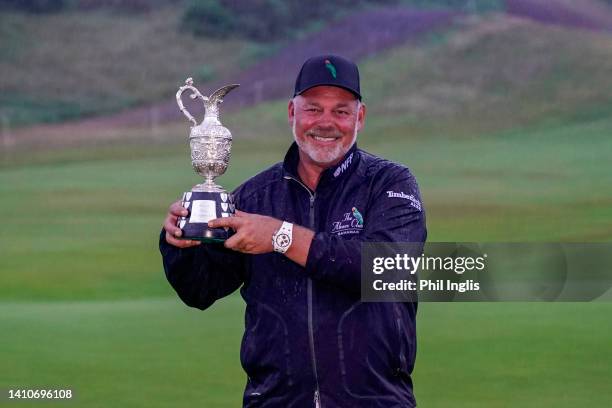 Darren Clarke of Northern Ireland poses with the trophy during Day Four of The Senior Open Presented by Rolex at The King's Course, Gleneagles on...