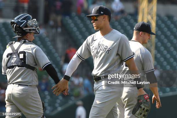 Jose Trevino and Aaron Judge of the New York Yankees celebrate a win after a baseball game against the Baltimore Orioles at Oriole Park at Camden...