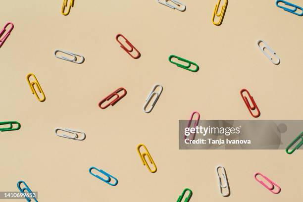 paper clips on beige blue. business concept. - clip art stockfoto's en -beelden