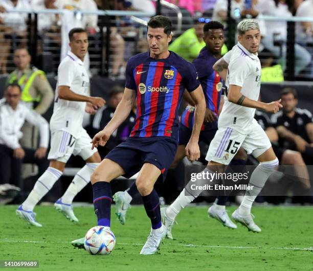 Robert Lewandowski of Barcelona dribbles the ball during a preseason friendly match against Real Madrid at Allegiant Stadium on July 23, 2022 in Las...